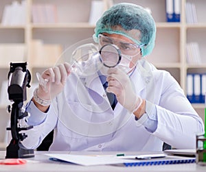 Forensics investigator working in lab on crime evidence