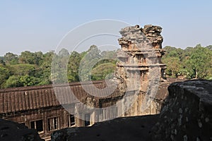 Forest behind old temple ruins of khmer city angkor wat, cambodia, beautiful tower, monument history