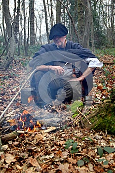 Forest camp man in woods photo