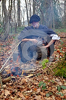 Forest camp man in woods photo