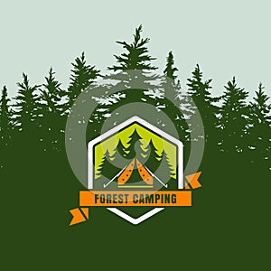 Forest camping logo emblem or label on background with green fir-trees forest. photo