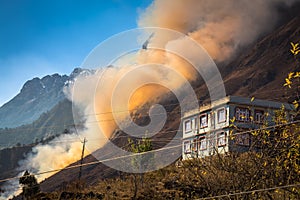 Forest fire burning on a hill in the Lachung, Sikkim India.