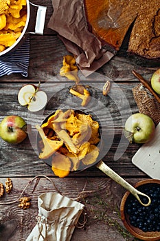 Forest harvest: blueberry, apples and chanterelle mushrooms