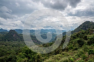 Forest Mountain Landscape with cloudy sky and a hut