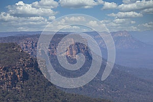 A forest near a cliff burnt by bushfire in regional Australia