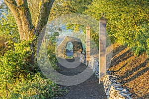 Forest path with stone and stele