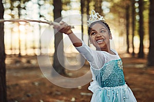 Forest, princess costume and girl with stick for playing fantasy, childhood games and happiness. Nature, fairy tale and