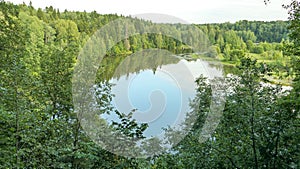 Forest river deadend in countryside of Russia under summer sky photo