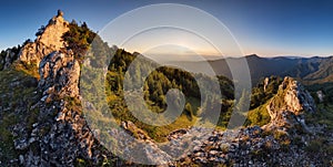 Forest and rocks mountain with sun at beautifull sunset - panorama, Slovakia