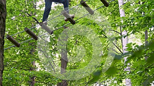 Forest Rope Park Obstacle Course Made with Nylon Climbing Ropes Tied Together with Strong Knots.People overcoming