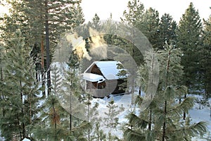 Forest shelter for hunters in the Siberian taiga in winter.