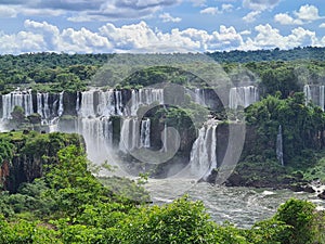 Forest surrounding a cascade of waterfalls in foz do iguacu, one of the 7 natural wonders f the world