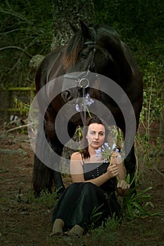 Forest woman with black horse