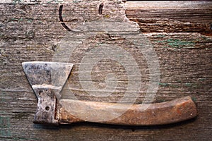 Forestry. Metal sharpen axe tool on the old wooden desk. Rural life in the farm