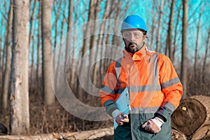 Forestry technician portrait during logging process in forest