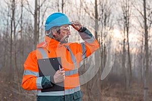 Forestry technician posing in forest