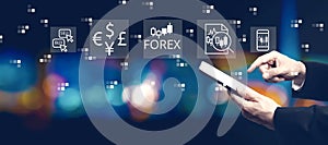 Forex trading concept with businessman using a tablet computer