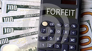 FORFEIT - word written on a calculator on the background of banknotes
