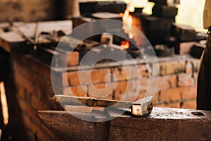 Forge, hammer on an anvil standing on the street