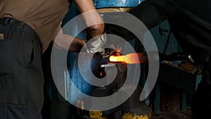 Forge, production of heat treatment and forging of metal parts, factory, close-up, smithy
