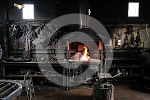 Forge, production workshop. Blacksmith tools and hot metal.