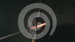 Forge workshop. Smithy manual production. Hands of smith with hammer hit on glowing hot metal, on the anvil, the forging