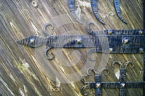 Forged elements of a wooden structured door