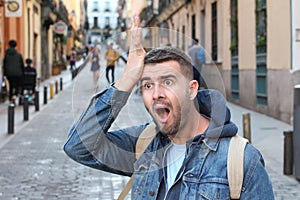 Forgetful man walking in the city