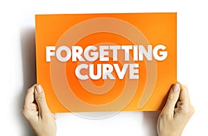 Forgetting Curve - the decline of memory retention in time, text concept on card