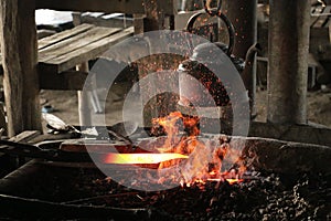 Forging blade for sword in forge on Inle Lake, Myanmar Burma