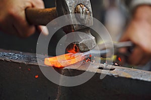 Forging hot iron