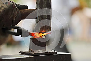 Forging hot iron