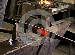 Forging hot iron