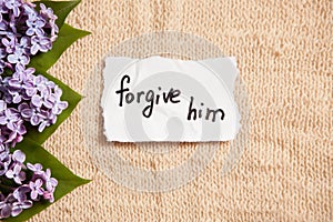Forgive him, forgiveness concept on beautiful background with flowers
