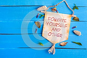 Forgive yourself and other text on Paper Scroll photo