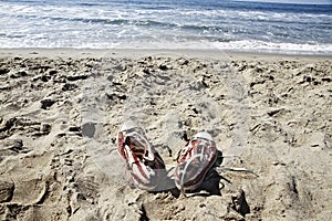 Forgotten shoes on the beach