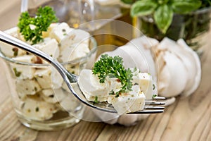 Fork with Feta Cheese on wood