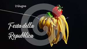 Fork with fresh pasta, tomato and basil. Related to national Italy day. Black background and an italian pasta with the text: Festa