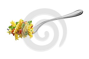 Fork with fusilli pasta broccoli tomatoes and aromatic herbs