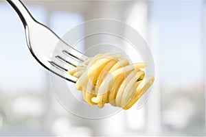 Fork with just spaghetti around it on background