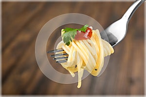 Fork with just spaghetti around it on backgrouund