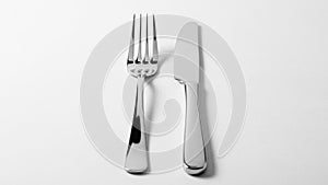 On their smooth surfaces. The fork with four tines is placed to