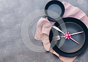 Fork, knife, spoon, silverware with pink on pink background for catering