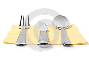 Fork, knife and spoon on table-napkin