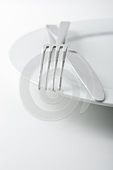 Fork and Knife on White Plate