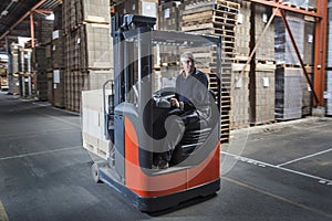 Fork lift operator preparing products for shipment