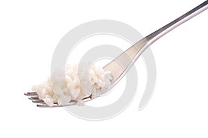 Fork with rice isolated on a white photo