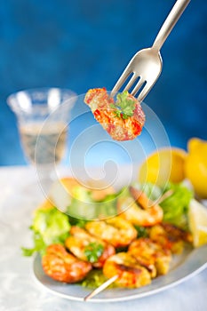 Fork with shrimp skew photo