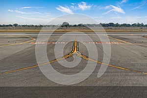 Fork signs, exit from the runway to the taxiways at the airport. Yellow lines markings for aircraft movement with