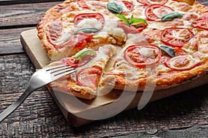 Fork on slice pizza. Close-up